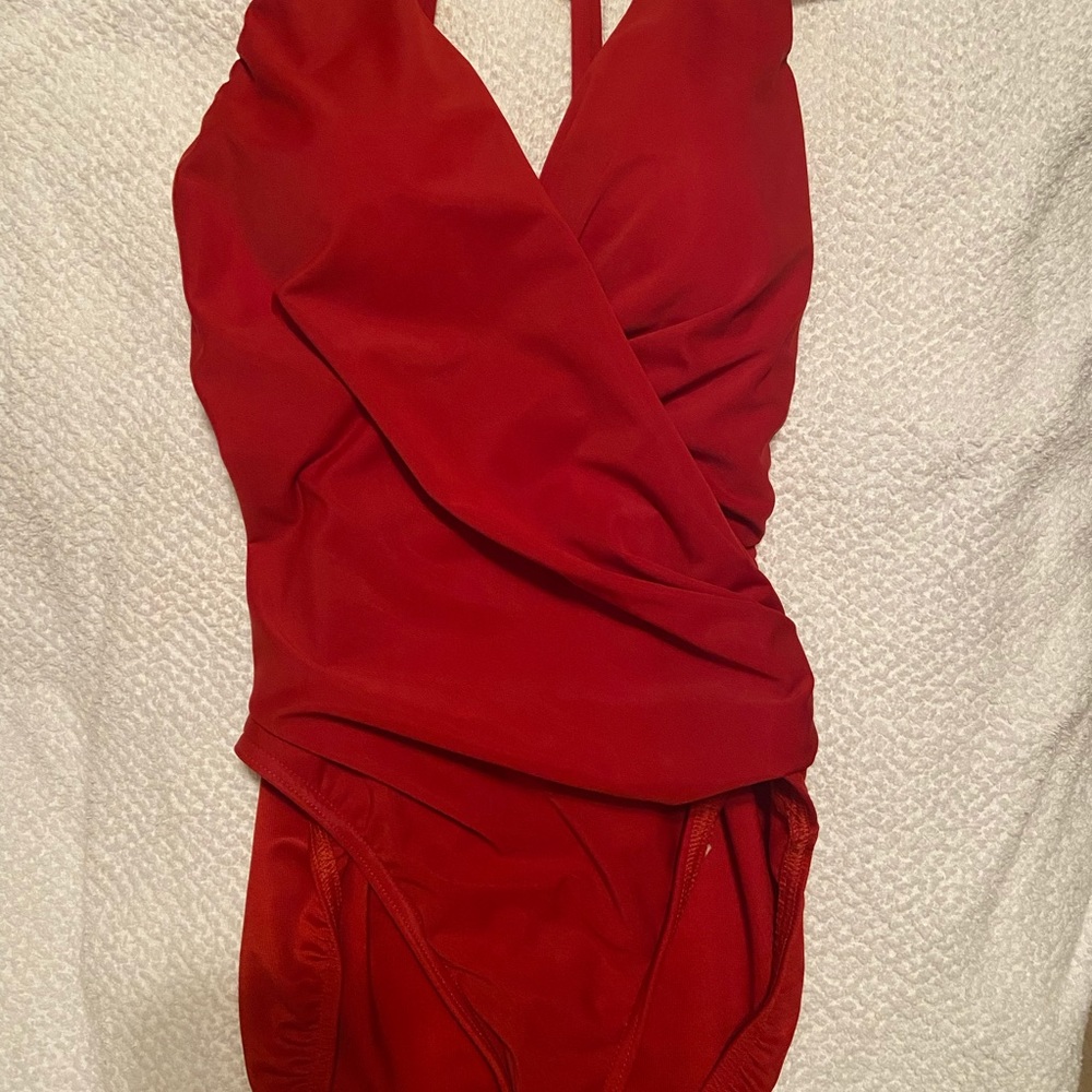 Miraclesuit. I purchased this last year but never wore it. Sooo flattering!
